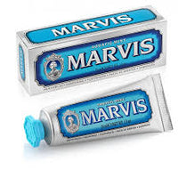 Two tubes of Marvis toothpaste on a white background